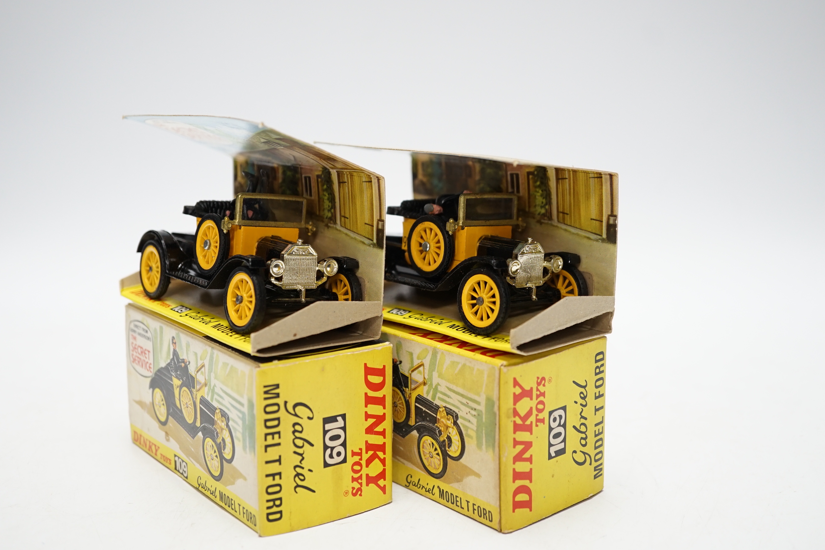 Two Dinky Toys (109) Gabriel Model T Ford, both boxed with inner display stands